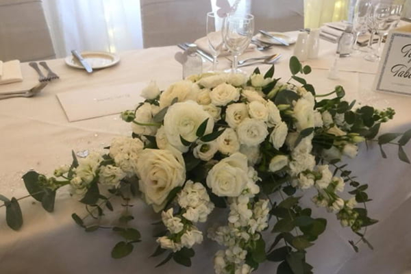 Bridal bouquet held in the wedding car